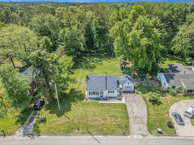 509 W W Burr Oak St, Centreville, MI 49032 - aerial view of property and surrounding area featuring a heavily wooded area