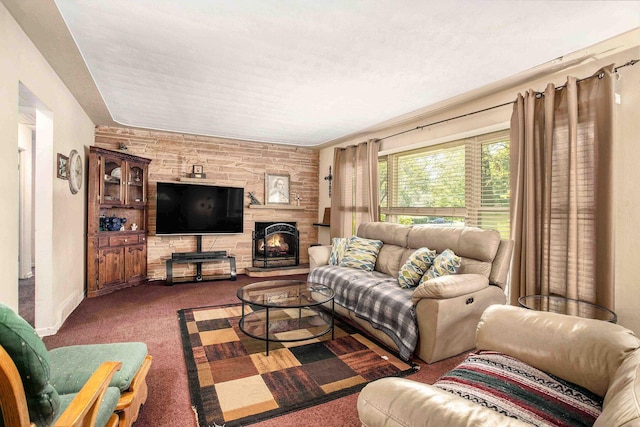 living area with carpet flooring, a fireplace, and baseboards