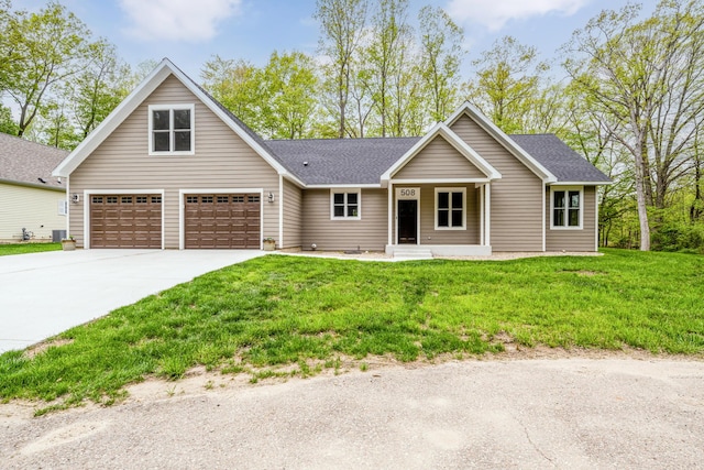 508 S Jameson St, New Buffalo, MI 49117 - view of front of property featuring driveway, a front lawn, a shingled roof, and covered porch