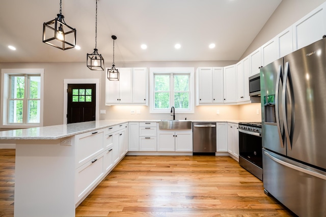 508 S Jameson St, New Buffalo, MI 49117 - kitchen with stainless steel appliances, a sink, a peninsula, healthy amount of natural light, and recessed lighting