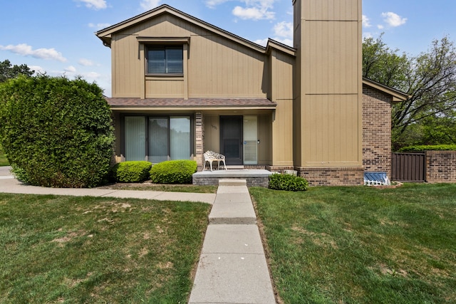 1696 S Hill Blvd, Bloomfield Hills, MI 48304 - view of front facade featuring brick siding, covered porch, and a shingled roof