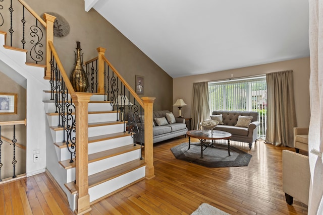 1696 S Hill Blvd, Bloomfield Hills, MI 48304 - living area with lofted ceiling, wood-type flooring, and stairs