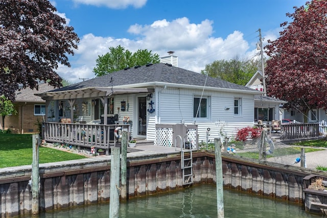 133 Loretta St, East China, MI 48054 - back of house featuring a deck with water view, a chimney, a pergola, roof with shingles, and a yard