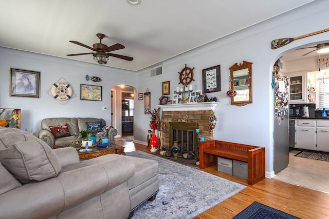 133 Loretta St, East China, MI 48054 - living area featuring arched walkways, ceiling fan, and plenty of natural light