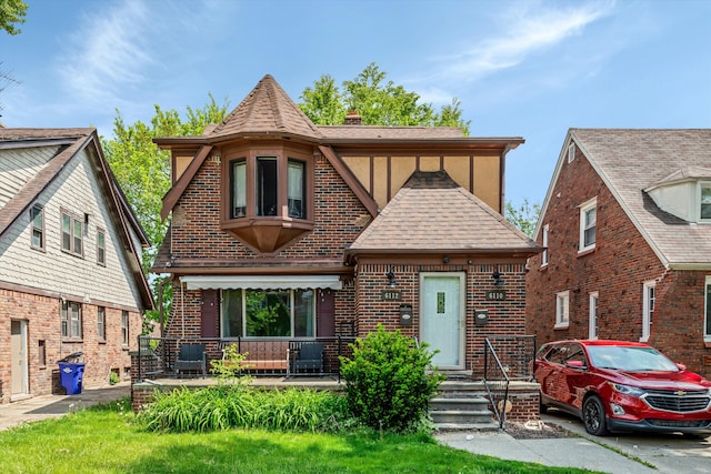 6110 Yorkshire Rd, Detroit, MI 48224 - tudor home with brick siding and a shingled roof