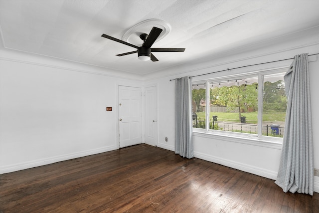 6110 Yorkshire Rd, Detroit, MI 48224 - spare room featuring a ceiling fan, dark wood-type flooring, and baseboards