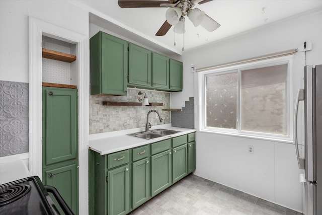6110 Yorkshire Rd, Detroit, MI 48224 - kitchen featuring freestanding refrigerator, green cabinets, a sink, ceiling fan, and ornamental molding