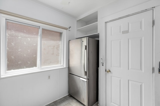 6110 Yorkshire Rd, Detroit, MI 48224 - kitchen with freestanding refrigerator, crown molding, and open shelves