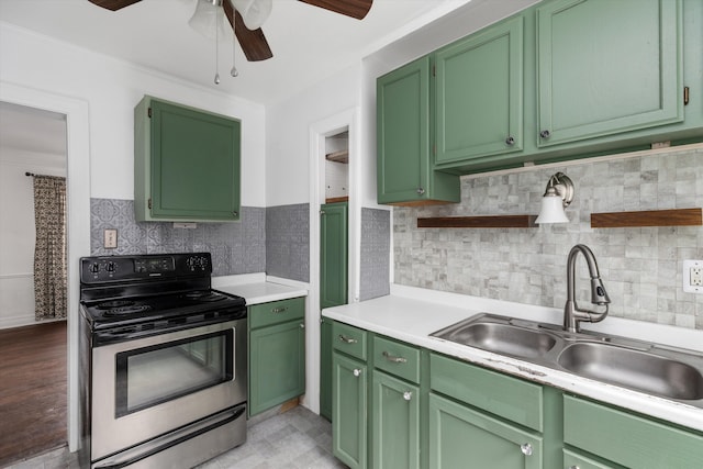 6110 Yorkshire Rd, Detroit, MI 48224 - kitchen featuring stainless steel electric range, a sink, a ceiling fan, open shelves, and green cabinets