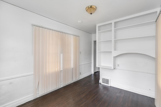 6110 Yorkshire Rd, Detroit, MI 48224 - unfurnished living room featuring dark wood-style flooring