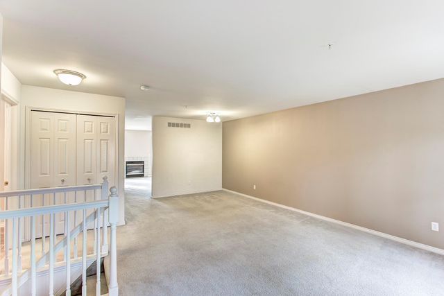 3986 Forester Blvd, Auburn Hills, MI 48326 - unfurnished bedroom featuring light carpet and baseboards