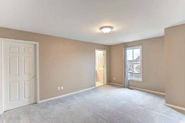 3986 Forester Blvd, Auburn Hills, MI 48326 - unfurnished room with light colored carpet and baseboards