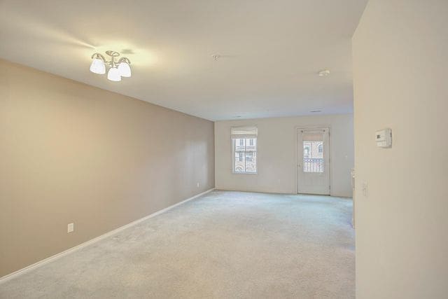 3986 Forester Blvd, Auburn Hills, MI 48326 - spare room with light carpet and baseboards