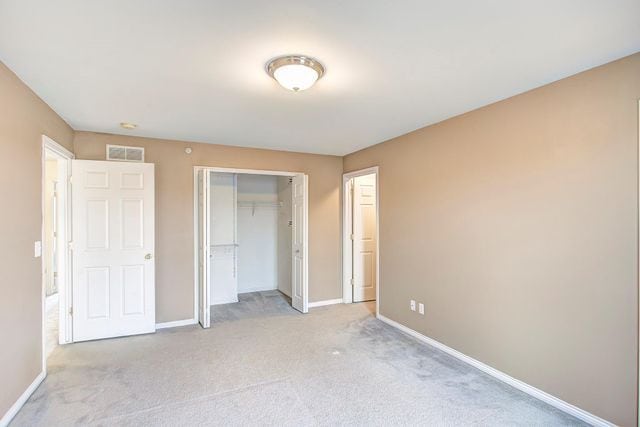 3986 Forester Blvd, Auburn Hills, MI 48326 - unfurnished bedroom featuring baseboards, carpet flooring, and a closet