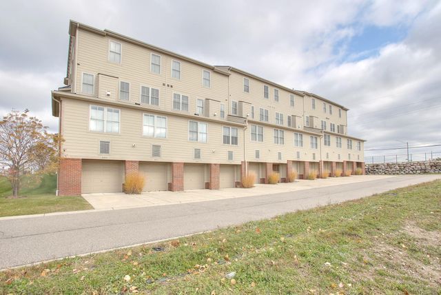 3986 Forester Blvd, Auburn Hills, MI 48326 - view of building exterior featuring an attached garage
