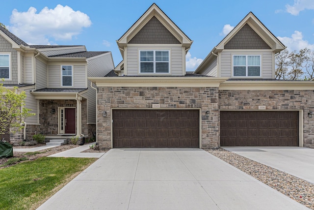 3328 Roseford Blvd, Ann Arbor, MI 48105 - craftsman-style home featuring concrete driveway, an attached garage, and stone siding