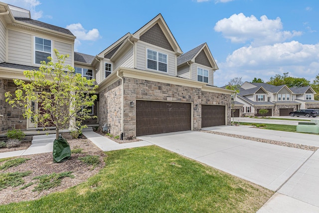 3328 Roseford Blvd, Ann Arbor, MI 48105 - view of front of property with an attached garage, concrete driveway, stone siding, a front lawn, and a residential view