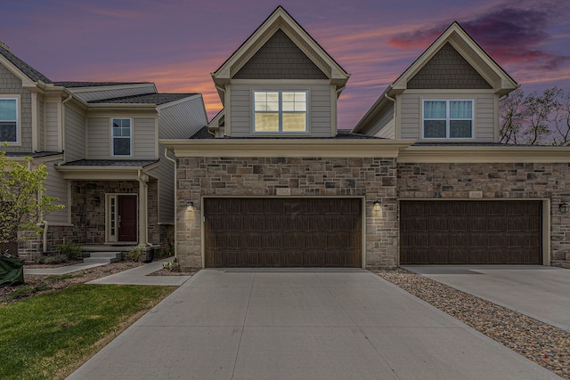 3328 Roseford Blvd, Ann Arbor, MI 48105 - craftsman-style home with driveway, an attached garage, and stone siding