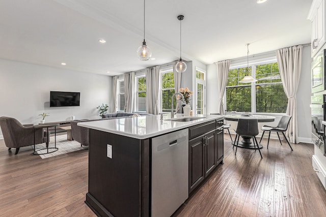 3328 Roseford Blvd, Ann Arbor, MI 48105 - kitchen featuring a sink, dishwasher, light countertops, an island with sink, and decorative light fixtures
