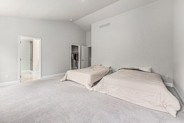 3328 Roseford Blvd, Ann Arbor, MI 48105 - bedroom featuring carpet, a walk in closet, lofted ceiling, baseboards, and a closet