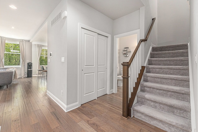 3328 Roseford Blvd, Ann Arbor, MI 48105 - entryway with wood finished floors, baseboards, stairs, and recessed lighting