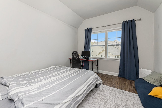 3328 Roseford Blvd, Ann Arbor, MI 48105 - bedroom with vaulted ceiling, wood finished floors, and baseboards