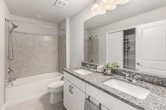 3328 Roseford Blvd, Ann Arbor, MI 48105 - bathroom featuring tile patterned floors, shower / tub combination, toilet, and double vanity
