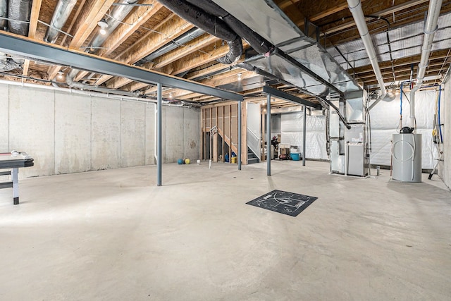 3328 Roseford Blvd, Ann Arbor, MI 48105 - unfinished below grade area featuring heating unit, stairs, water heater, and a water softener system