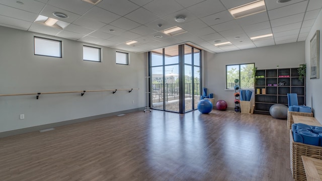 3328 Roseford Blvd, Ann Arbor, MI 48105 - workout room with wood finished floors, a drop ceiling, and baseboards