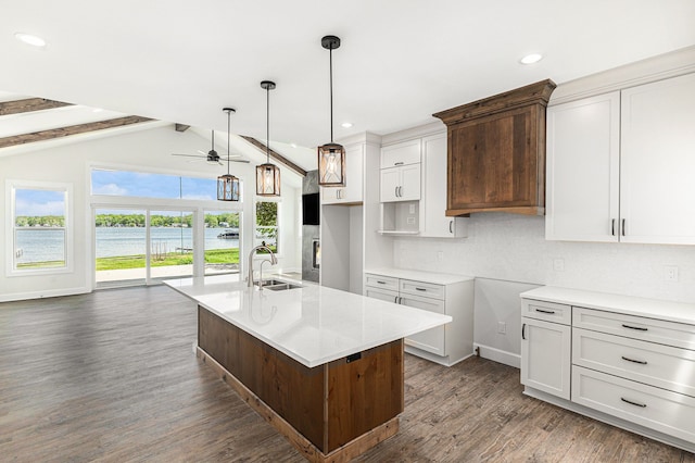 9693 Beverly Dr, Lakeland, MI 48143 - kitchen with ceiling fan, dark wood-style flooring, a sink, an island with sink, and recessed lighting