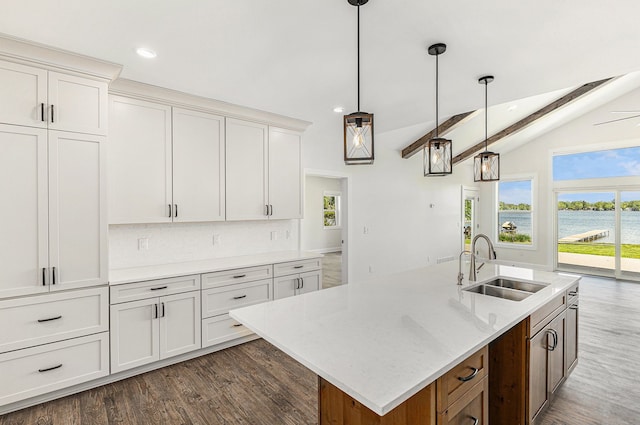 9693 Beverly Dr, Lakeland, MI 48143 - kitchen featuring a sink, dark wood finished floors, recessed lighting, hanging light fixtures, and white cabinetry
