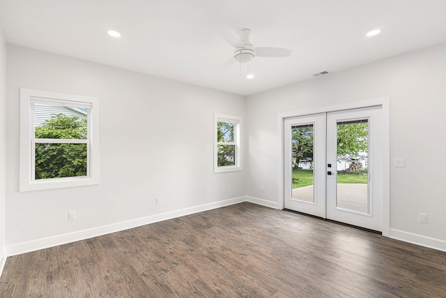 9693 Beverly Dr, Lakeland, MI 48143 - spare room featuring french doors, dark wood-type flooring, baseboards, and recessed lighting