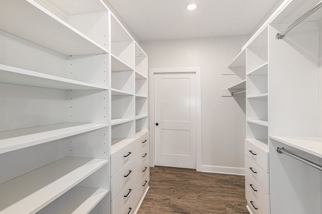 9693 Beverly Dr, Lakeland, MI 48143 - spacious closet featuring dark wood finished floors