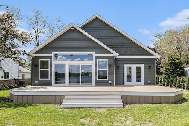 9693 Beverly Dr, Lakeland, MI 48143 - back of house featuring a yard, a deck, french doors, and central AC unit