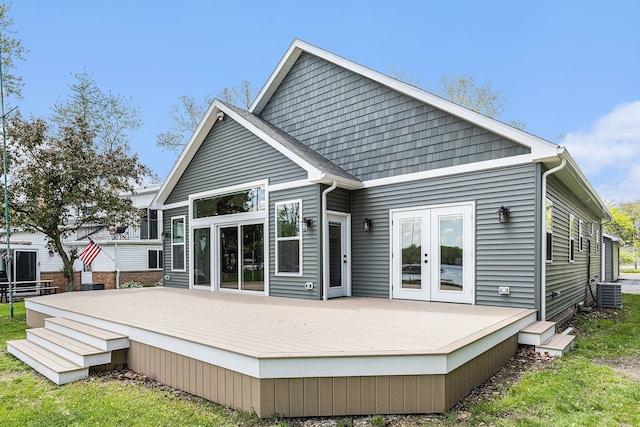 9693 Beverly Dr, Lakeland, MI 48143 - rear view of house featuring french doors, a deck, and central AC