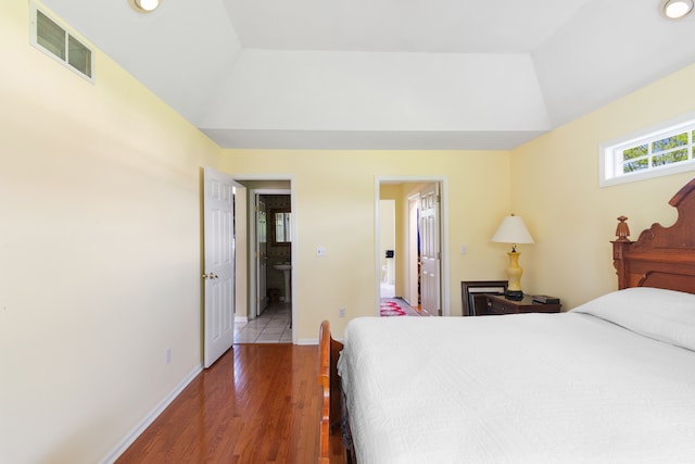 bedroom with wood finished floors, baseboards, and recessed lighting