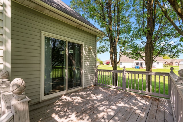 wooden deck with a residential view and a yard