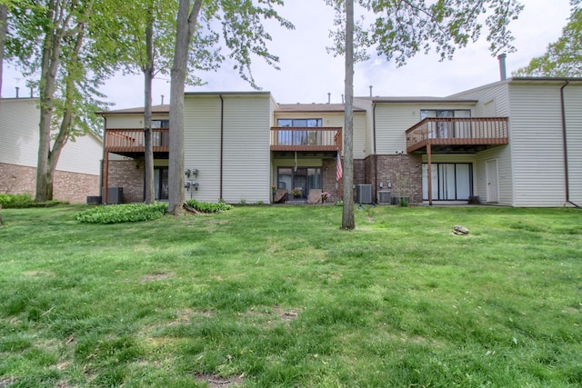 35844 Castlewood Ct, Westland, MI 48185 - rear view of house featuring a wooden deck, cooling unit, and a yard