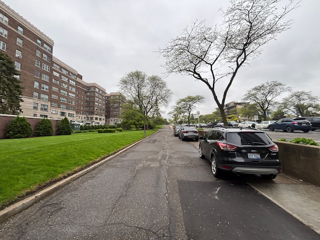 8162 E Jefferson Ave Unit 16B, Detroit, MI 48214 - view of asphalt street featuring curbs and sidewalks