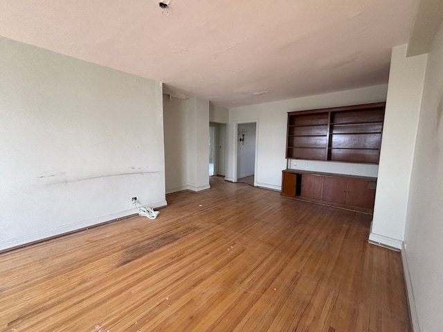 8162 E Jefferson Ave Unit 16B, Detroit, MI 48214 - empty room featuring hardwood / wood-style floors and baseboards