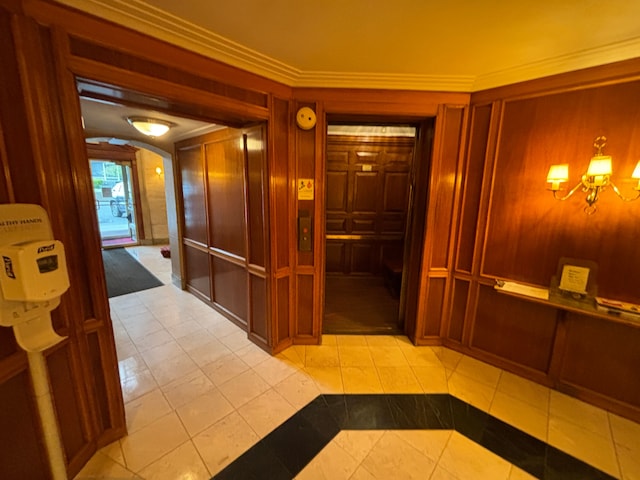 8162 E Jefferson Ave Unit 16B, Detroit, MI 48214 - hallway with light tile patterned floors, arched walkways, a chandelier, crown molding, and wooden walls