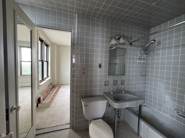 8162 E Jefferson Ave Unit 16B, Detroit, MI 48214 - full bathroom with toilet, a sink, shower / washtub combination, and tile walls