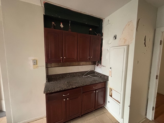 8162 E Jefferson Ave Unit 16B, Detroit, MI 48214 - kitchen with decorative backsplash and light tile patterned flooring