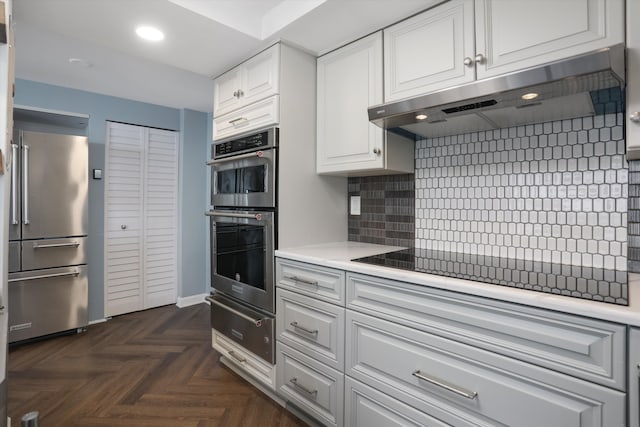 1300 E Lafayette St Unit 2003, 04, 05, Detroit, MI 48207 - kitchen featuring stainless steel appliances, a warming drawer, under cabinet range hood, light countertops, and recessed lighting