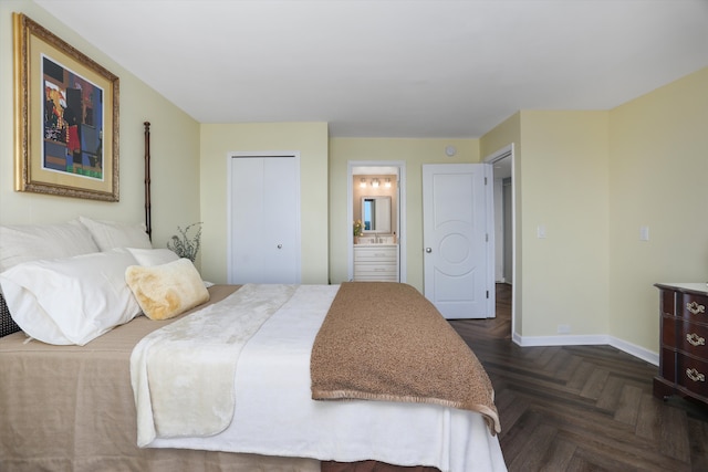 1300 E Lafayette St Unit 2003, 04, 05, Detroit, MI 48207 - bedroom with baseboards and ensuite bath