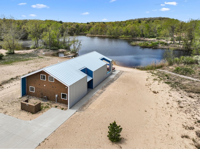 7469 Lake Solis Dr, Stevensville, MI 49127 - aerial view of property and surrounding area with a nearby body of water and a forest
