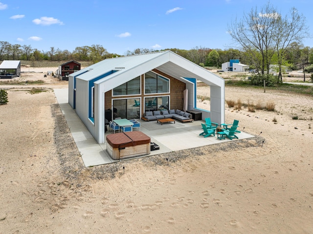 7469 Lake Solis Dr, Stevensville, MI 49127 - back of house featuring an outdoor living space and a patio