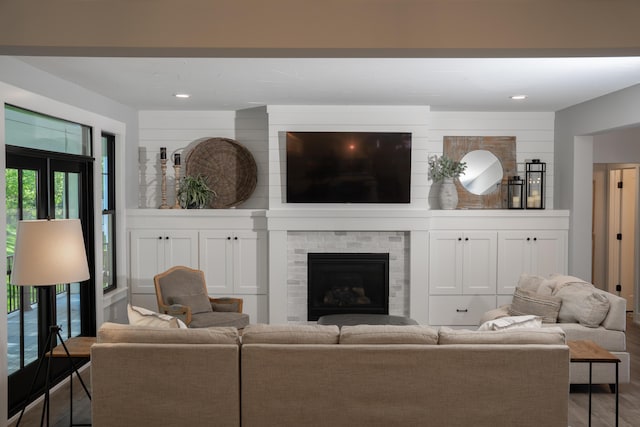 8182 Country Rail Dr SW, Byron Center, MI 49315 - living area with wood finished floors, a brick fireplace, and recessed lighting