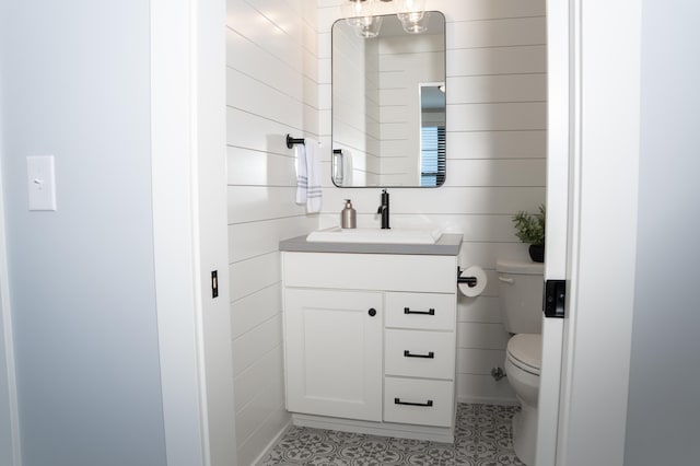 8182 Country Rail Dr SW, Byron Center, MI 49315 - bathroom with toilet, vanity, and tile patterned flooring