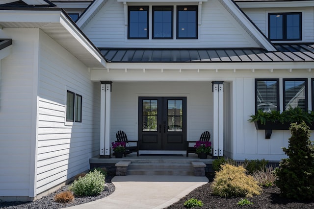 8182 Country Rail Dr SW, Byron Center, MI 49315 - doorway to property with french doors, a standing seam roof, covered porch, and metal roof